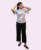 Full length women's sky blue floral print collared shirt flutter sleeve workwear blouse black trousers Ladymade
