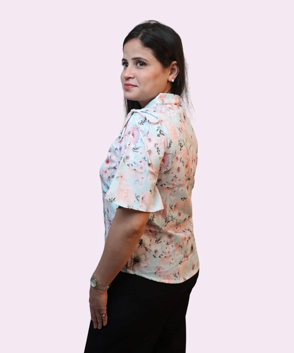 Side profile women's sky blue floral print collared workwear shirt flutter sleeve shape Ladymade