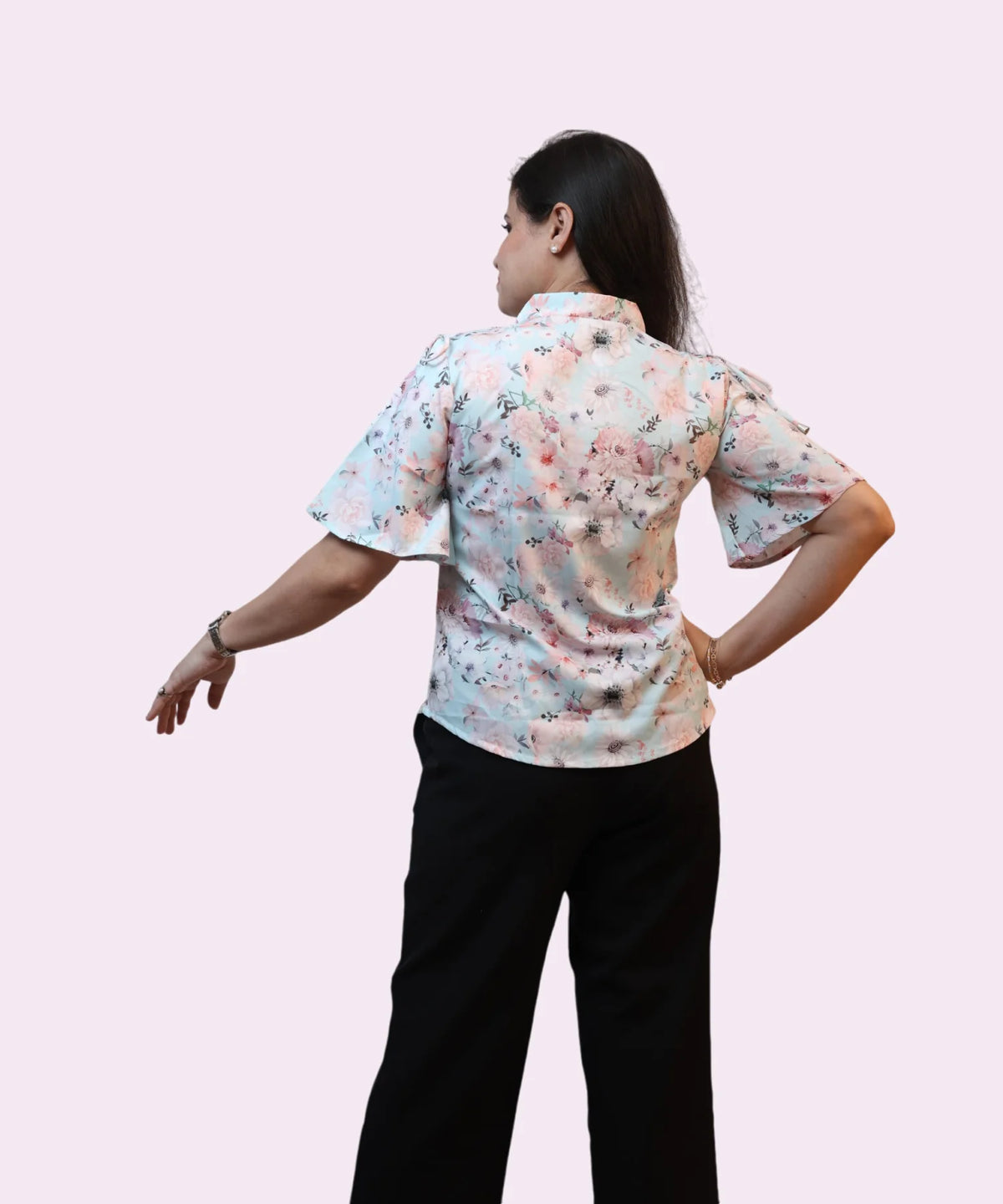 Back view women's sky blue floral print collared shirt flutter sleeve workwear blouse full length Ladymade