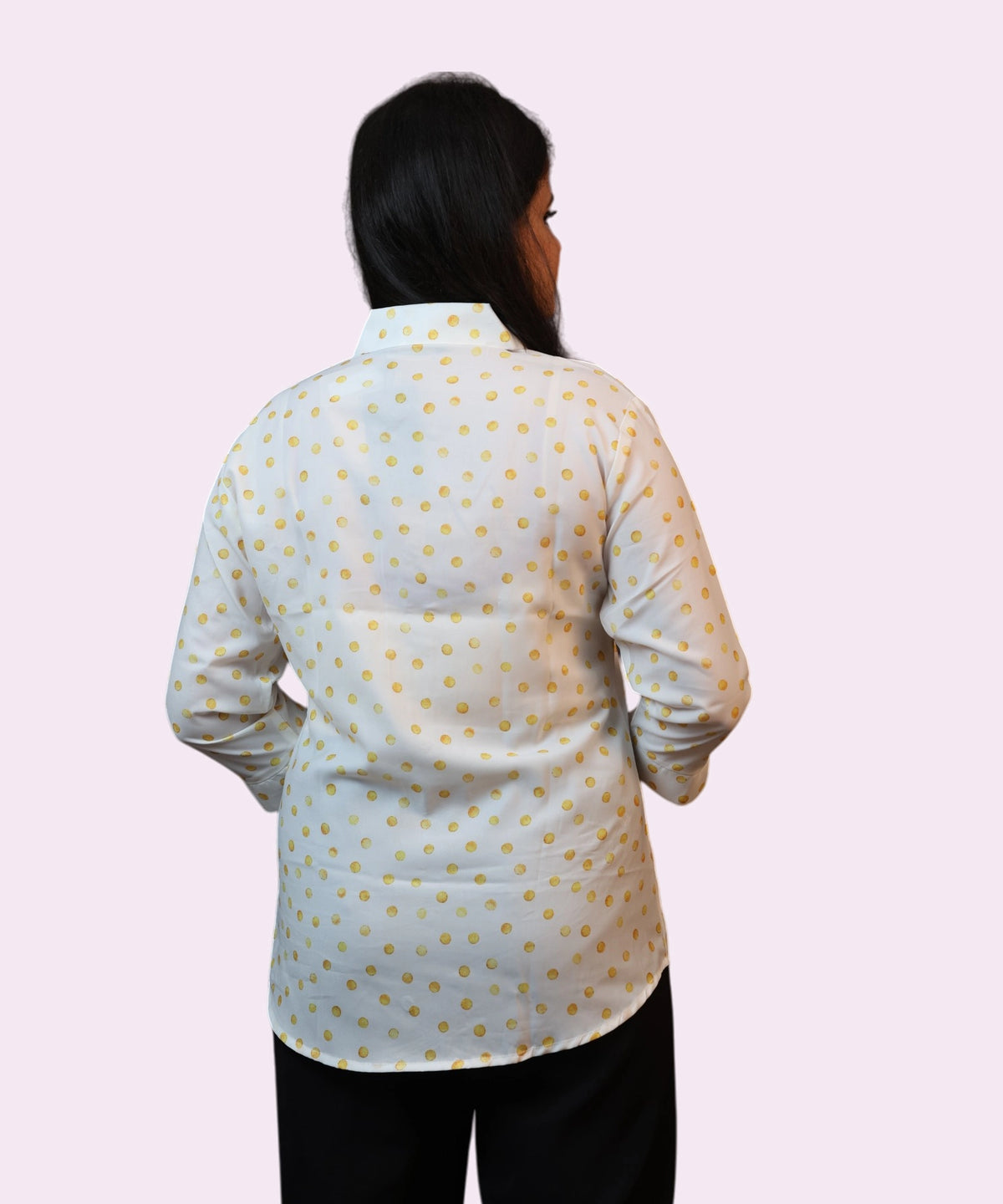 Back view of a women's yellow and white polka dot workwear shirt showing the regular fit by Ladymade.